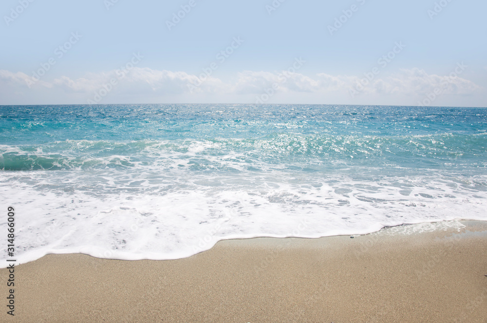  beautiful sandy beach and soft blue ocean wave 