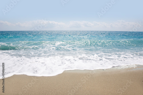  beautiful sandy beach and soft blue ocean wave 
