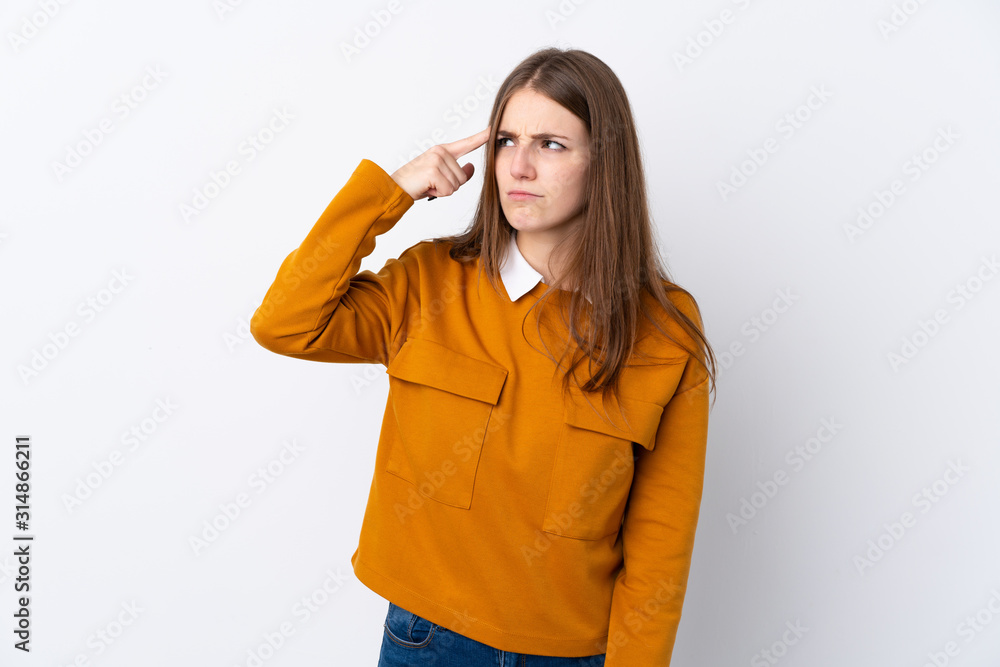 Young woman over isolated white background making the gesture of madness putting finger on the head Young woman over isolated white background making the gesture of madness putting finger on the head