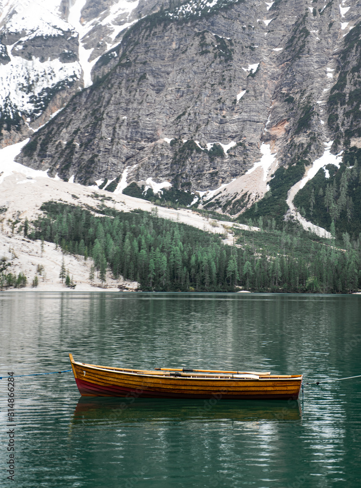 Lago di Braies in South Tyrol, Italy with it's famous floating wooden boats and turquoise water