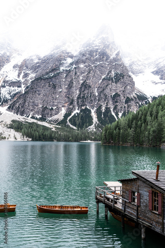 Lago di Braies in South Tyrol  Italy with it s famous floating wooden boats and turquoise water