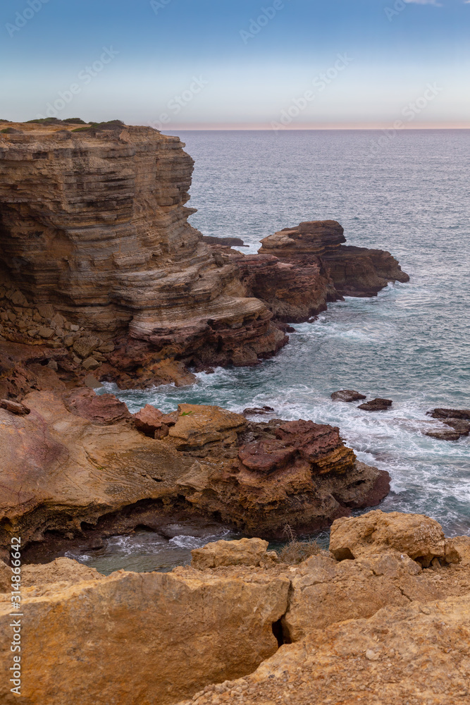 Rocky coastline in the Costa Vicentina natural park at the Atlantic Ocean at the Algarve, Portugal.
