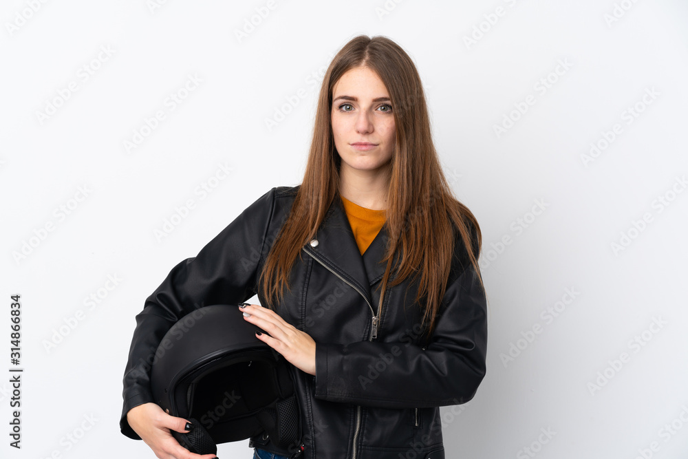 Woman with a motorcycle helmet keeping arms crossed Woman with a motorcycle helmet keeping arms crossed