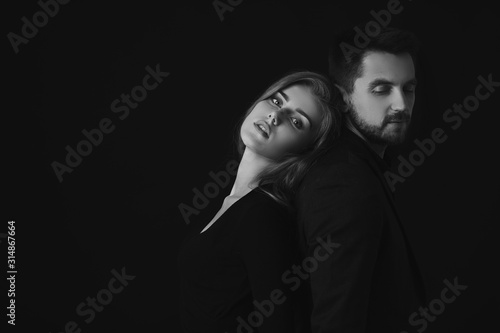 elegant fashion couple. man and beautiful woman in dress. black and white © producer