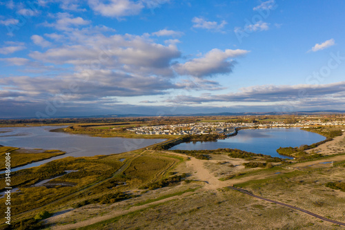 Pagham Harbour a nature reserve aerial view from the beach on a clear and beautiful day in January looking north towards Church Farm Holiday Village.