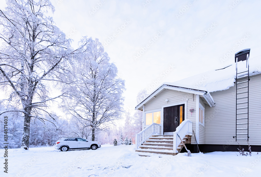 Φωτογραφία The house in the forest has covered with heavy snow in winter season at Lapland, Finland