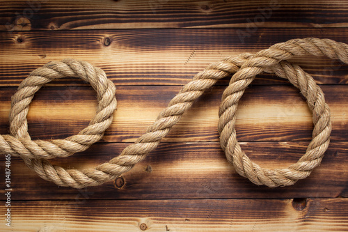 Obraz na płótnie ship rope at wooden background