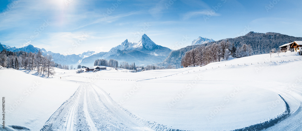 Winter wonderland scenery with cross-country skiing track in the Alps