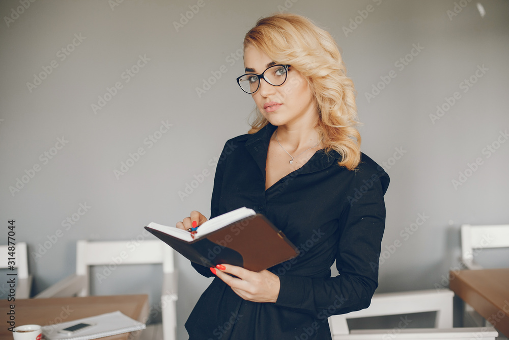 Pretty businesswoman working. Cute girl standing at the caffee. Woman use the notebook Pretty businesswoman working. Cute girl standing at the caffee. Woman use the notebook