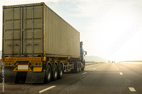 Cargo Truck on highway road with container, transportation concept.,import,export logistic industrial Transporting Land transport on the expressway against sunrise sky