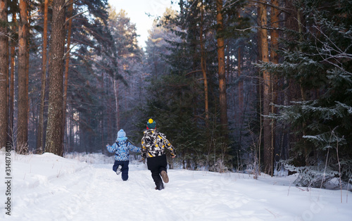 boys in winter forest