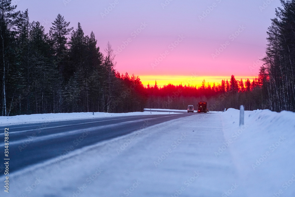 Karelia, Russia - January, 4, 2020: Landscape with the image of country road in Karelia at winter Karelia, Russia - January, 4, 2020: Landscape with the image of country road in Karelia at winter