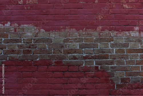  brick wall painted in shade of red. abstract background