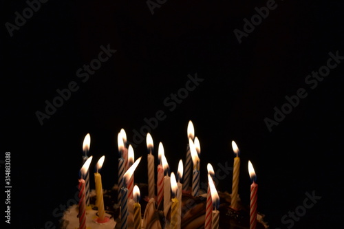 birthday cake with candles on black background