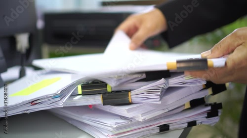 Auditor businesswoman checking information document legal prepare paperwork,feeling angry when can not find info report for analysis in TAX time, accountant in workload contract partner deal in office