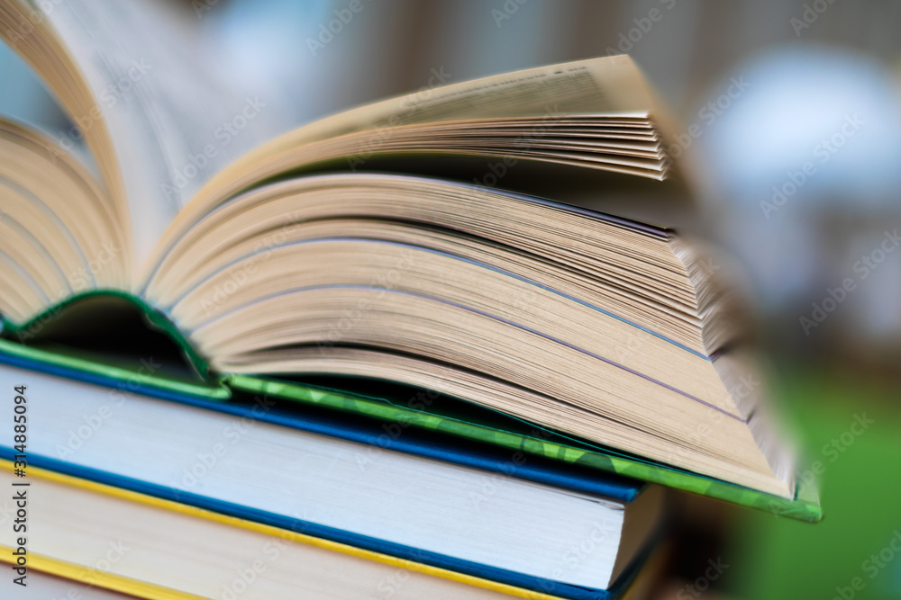 Open book lying on the table in the library Open book lying on the table in the library