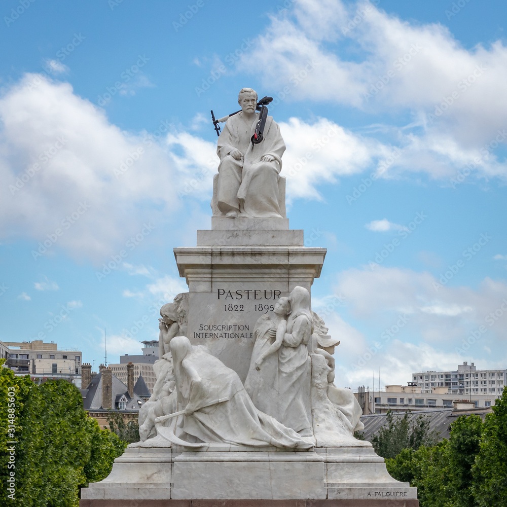 Louis Pasteur statue with kick scooter mounted on top of it, Paris