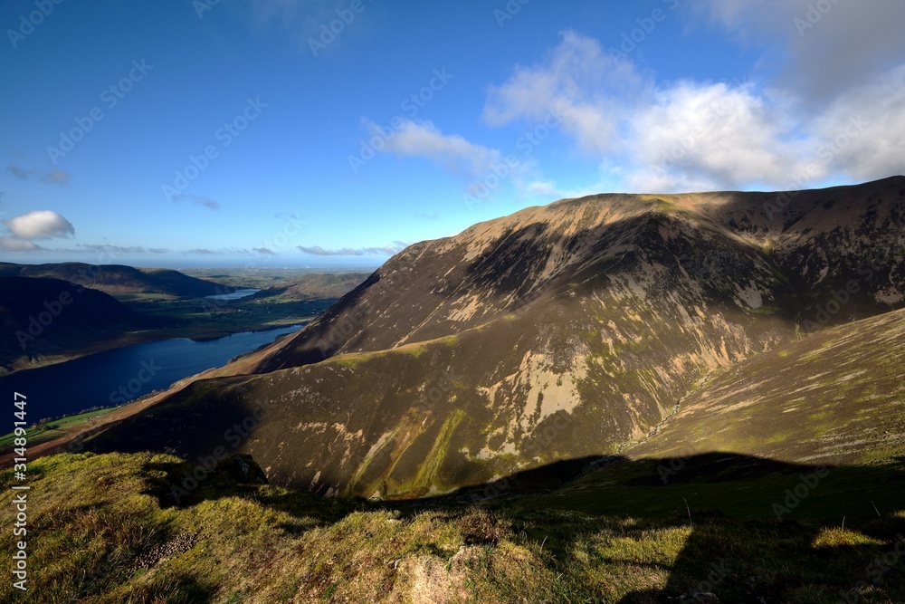 Sunlight on long ridge of Lad Hows