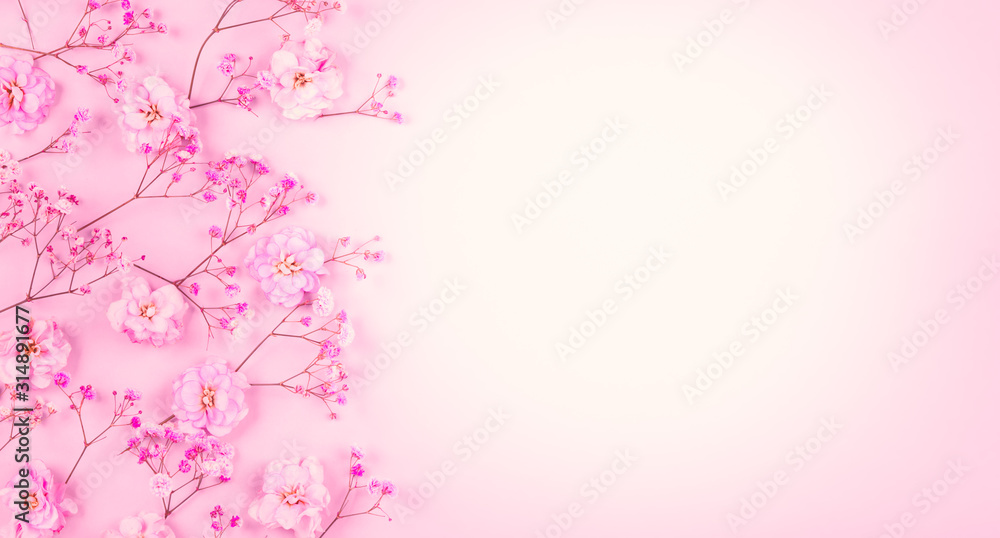 Spring floral composition made of fresh pink flowers on light pastel background Spring floral composition made of fresh pink flowers on light pastel background