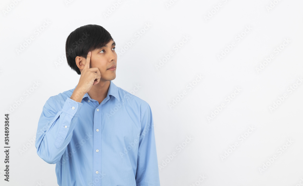Young handsome asian business man thinking an idea while looking up isolated on white background. Young handsome asian business man thinking an idea while looking up isolated on white background.