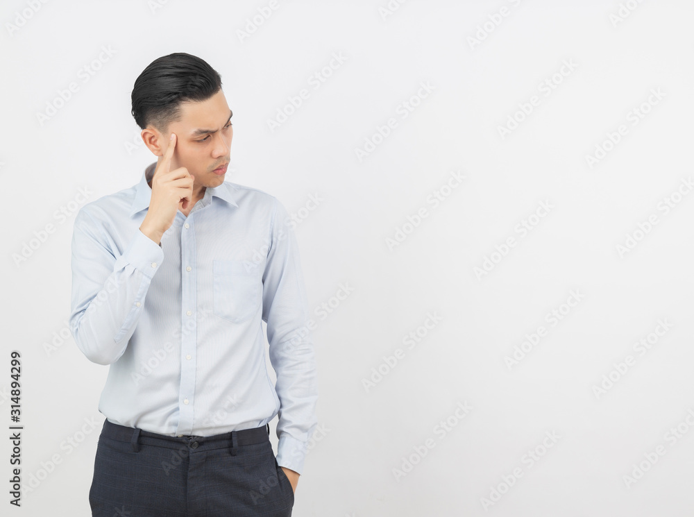Young handsome asian business man thinking an idea while looking up isolated on white background. Young handsome asian business man thinking an idea while looking up isolated on white background.