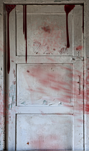 white wooden door stained with blood