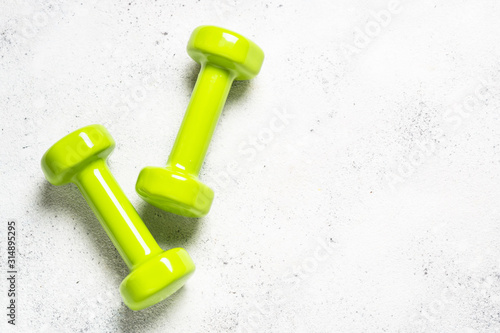 Dumbbells on white background top view. photo