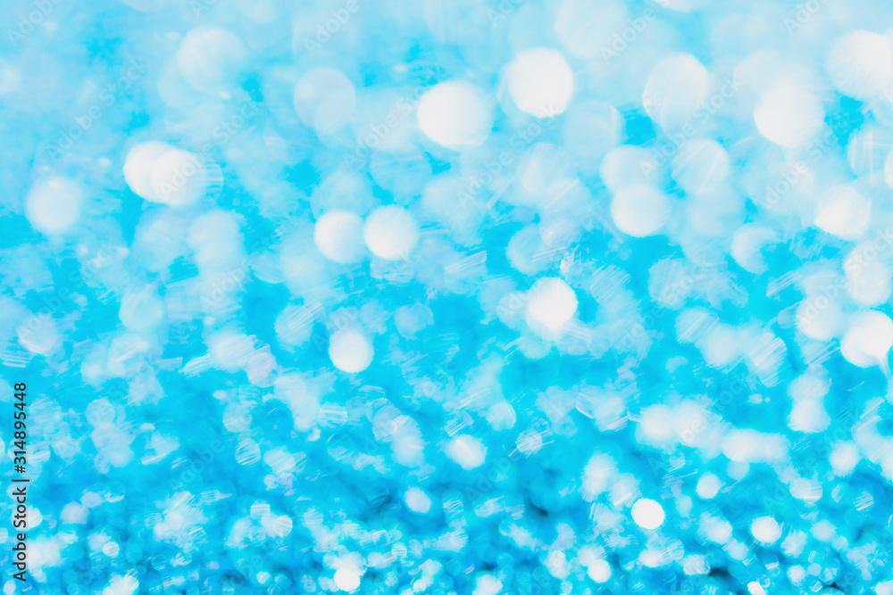 Defocused blue glitter background. blue abstract bokeh background. Christmas abstract background. Defocused blue glitter background. blue abstract bokeh background. Christmas abstract background.