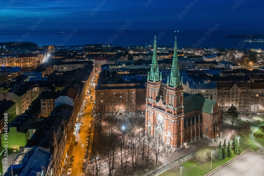 Helsinki. Finland. Church of St. John. Church in the Gothic style. Tours in Helsinki. The European Union. Aerial view Helsinki on night. Finland travel guide.