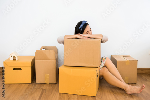 TIred woman sleep on moving box