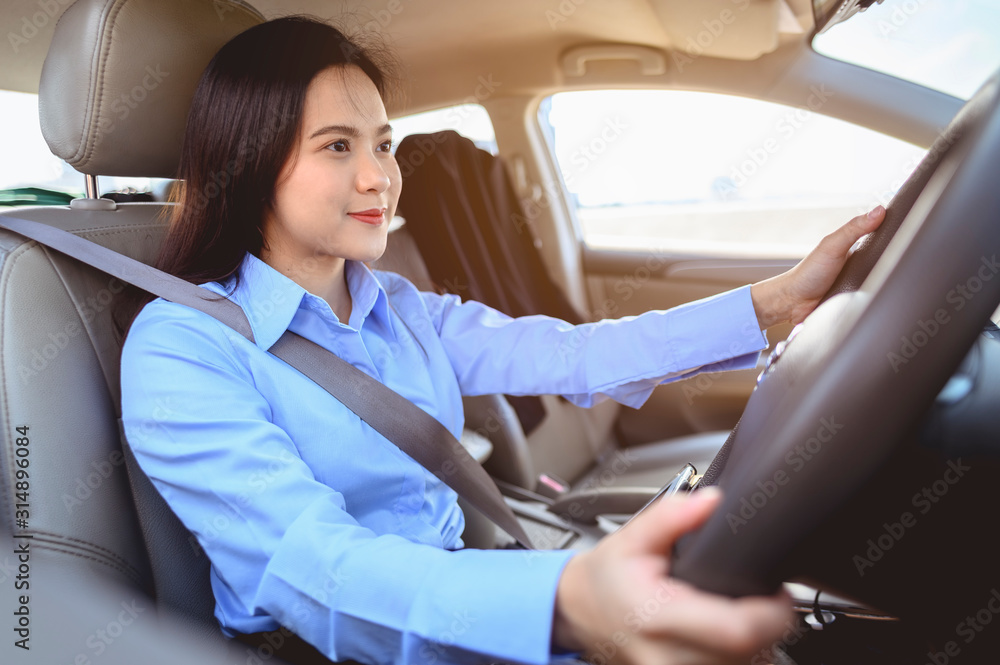 businesswoman, work, driving, multitasking, car, lifestyle concept. Businesswoman multitasking while driving car working and talking on cell phone on the road. businesswoman, work, driving, multitasking, car, lifestyle concept. Businesswoman multitasking while driving car working and talking on cell phone on the road.