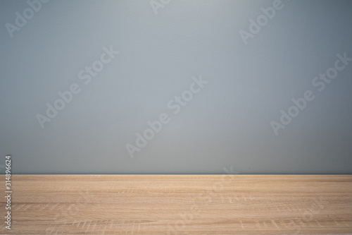 empty wooden table and wall