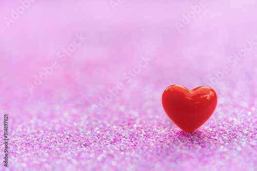 Valentines Day background with Red heart shapes on abstract light pink glitter background, Copy space