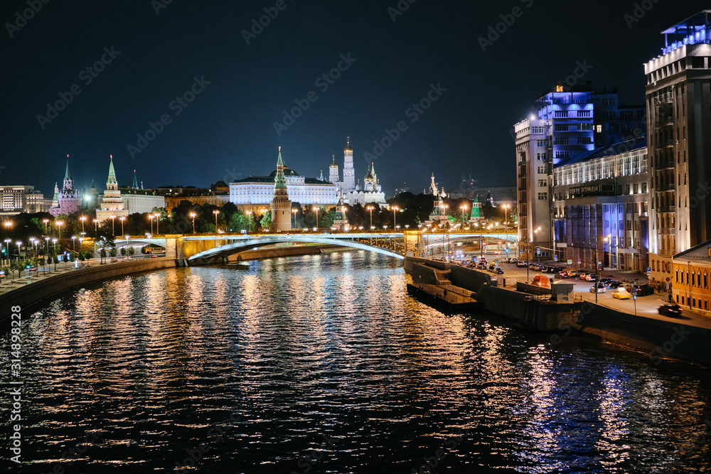 MOSCOW, RUSSIA - AUGUST, 2019: Moscow Kremlin and bridge through Moscow River at night