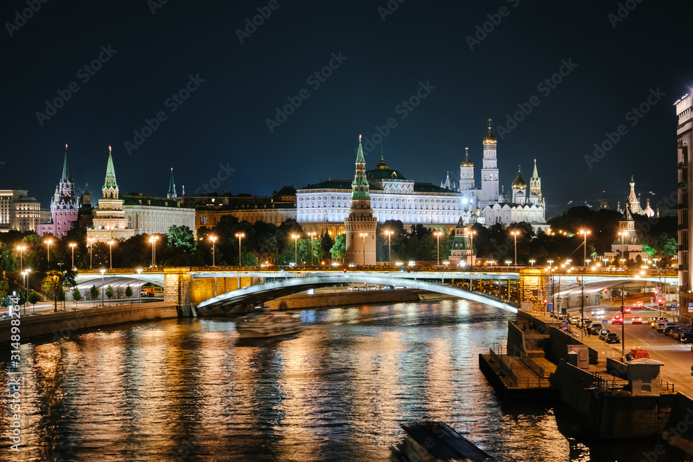MOSCOW, RUSSIA - AUGUST, 2019: Kremlin view from Patriarshii bridge at winter night in Moscow, Russia. MOSCOW, RUSSIA - AUGUST, 2019: Kremlin view from Patriarshii bridge at winter night in Moscow, Russia.