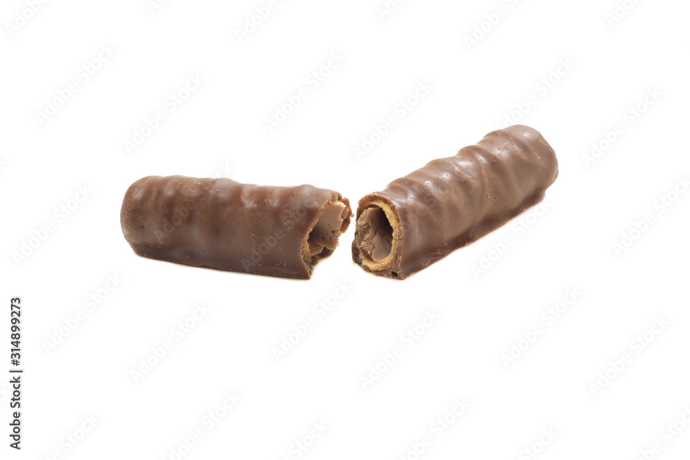 broken into two halves chocolate tubule on a white isolated background broken into two halves chocolate tubule on a white isolated background
