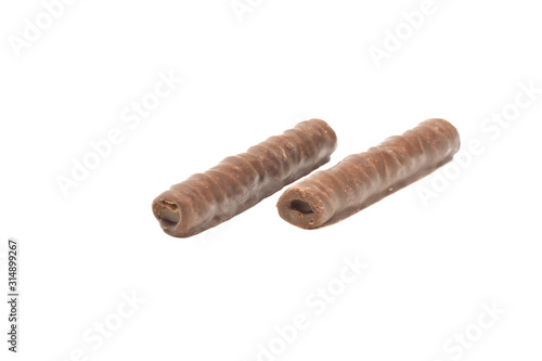 two chocolate tubules on a white isolated background