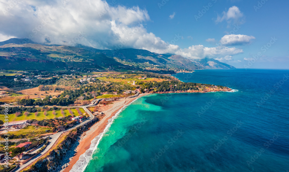 View from flying drone. Splendid morning view of popular italian destination - Guidaloca beach, Scopello location, Sicily, Europe. Sunny spring seascape of Mediterranean sea, Italy.