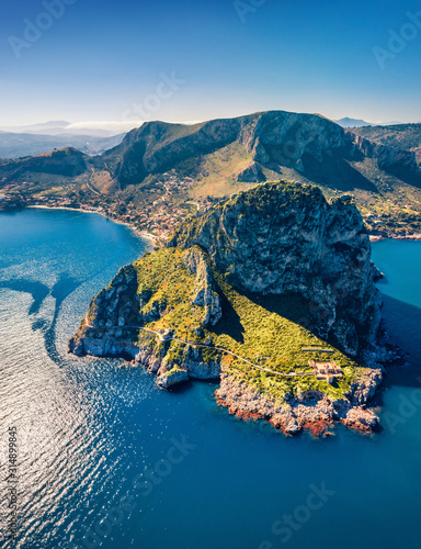 Top down view from flying drone. Amazing morning scene of Zafferano cape with old lighthouse. Incredible  spring seascape of Mediterranean sea, Sicily, Italy, Europe. Traveling concept background. photo