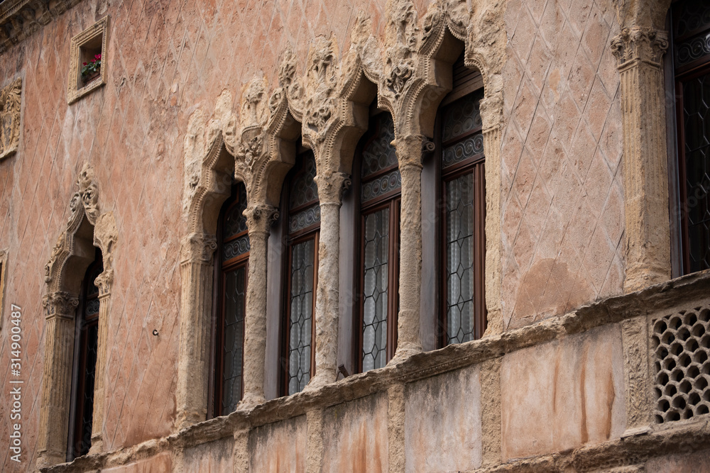 Old mullioned windows in Venetian style tuff in Padua, Italy. Old mullioned windows in Venetian style tuff in Padua, Italy.