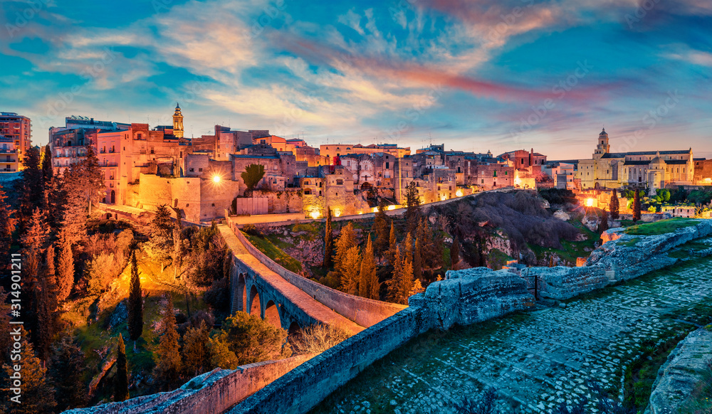 Obraz premium Fantastic spring dawn on Gravina in Puglia tovn. Attractive morning landscape of Apulia, Italy, Europe. Traveling concept background.