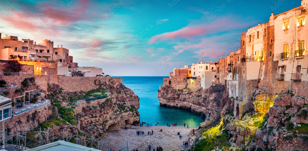 Spectacular spring cityscape of Polignano a Mare town, Puglia region, Italy, Europe. Colorful evening seascape of Adriatic sea. Traveling concept background..