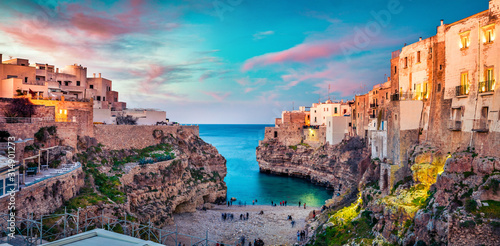 Spectacular spring cityscape of Polignano a Mare town, Puglia region, Italy, Europe. Colorful evening seascape of Adriatic sea. Traveling concept background.. © Andrew Mayovskyy
