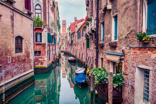 Marvelous summer cityscape of Vennice with famous water canal and colorful houses. Calm morning scene of Italy, Europe. Traveling concept background.