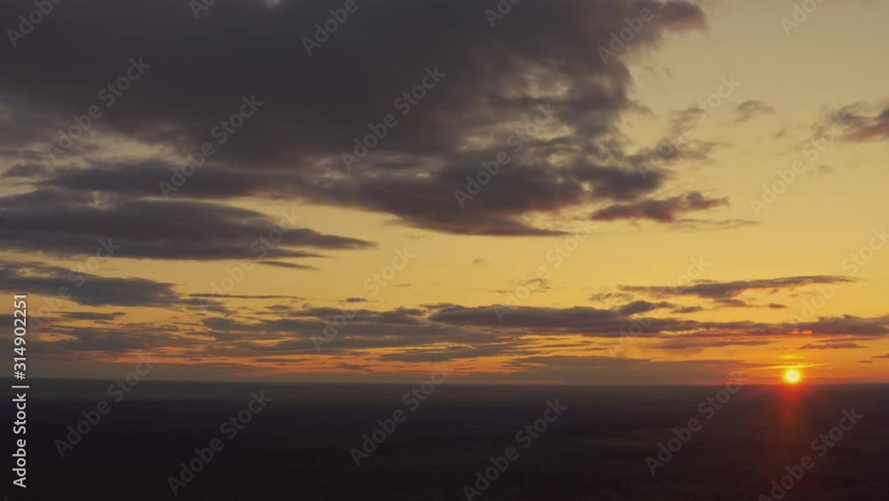 Aerial View Of Sunset Sky Above Green Forest Landscape In Sunny Evening. Top View Summer Sunrise Aerial View Of Sunset Sky Above Green Forest Landscape In Sunny Evening. Top View Summer Sunrise