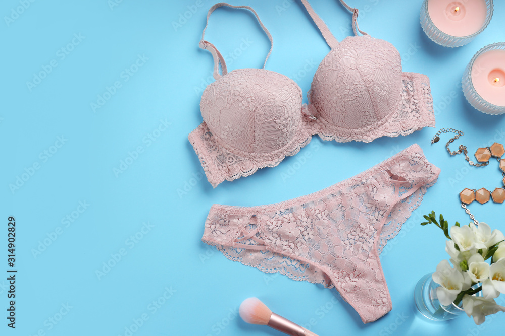 Flat lay composition with sexy women's underwear on light blue background. Space for text Flat lay composition with sexy women's underwear on light blue background. Space for text