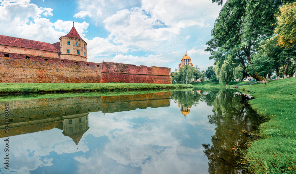 Fototapeta premium Amazing summer view of medieval Fagaras Citadel. Spectacular morninng scene of Transylvania, Romania, Europe. Traveling concept background.