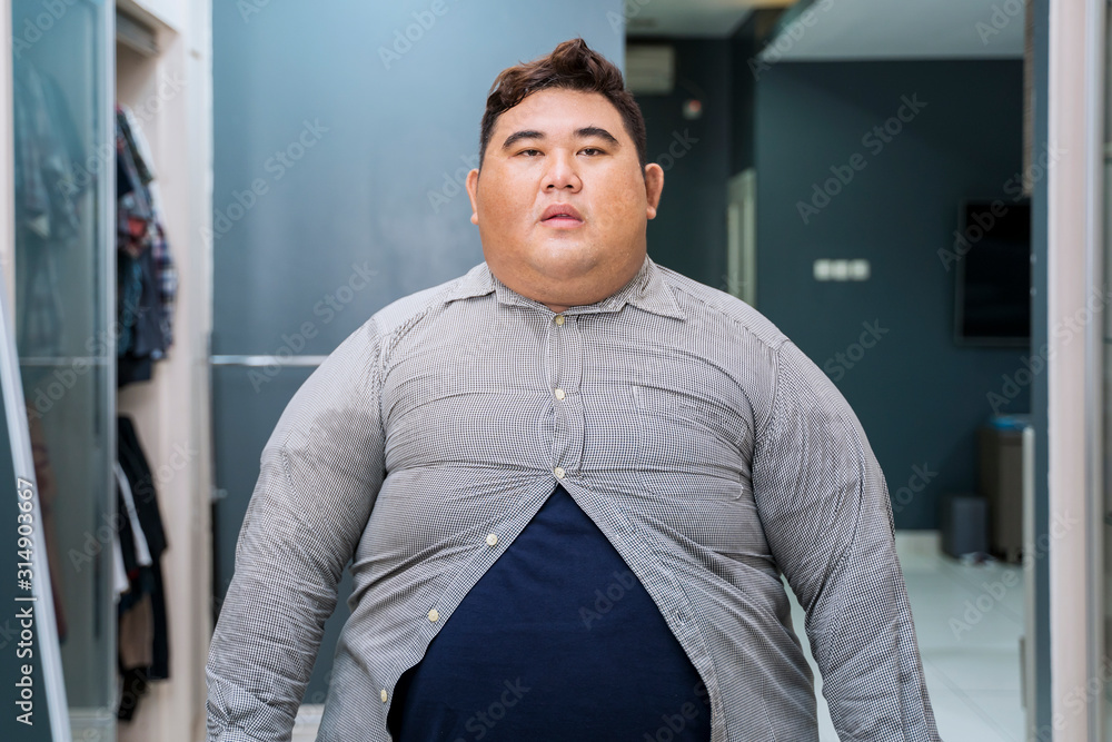 Fat Asian man wearing tight unbuttoned shirt - obrazy, fototapety, plakaty 