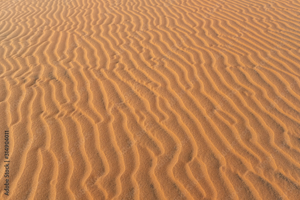 Abstract background and texture of sand waves in desert Abstract background and texture of sand waves in desert