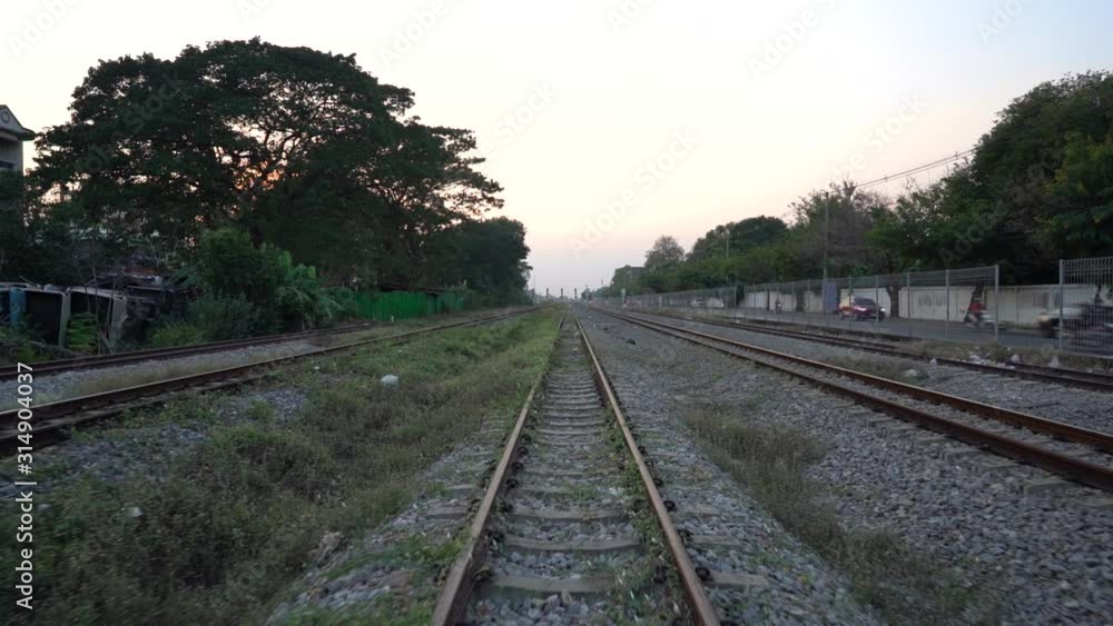 walking alone on railway slowly with sunset walking alone on railway slowly with sunset